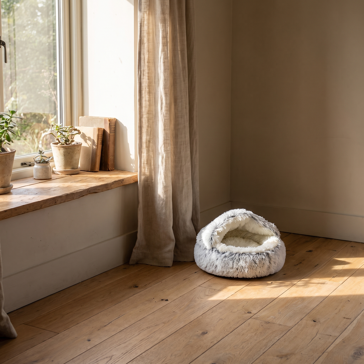 Nestly cat cave bed in a sunlit window nook