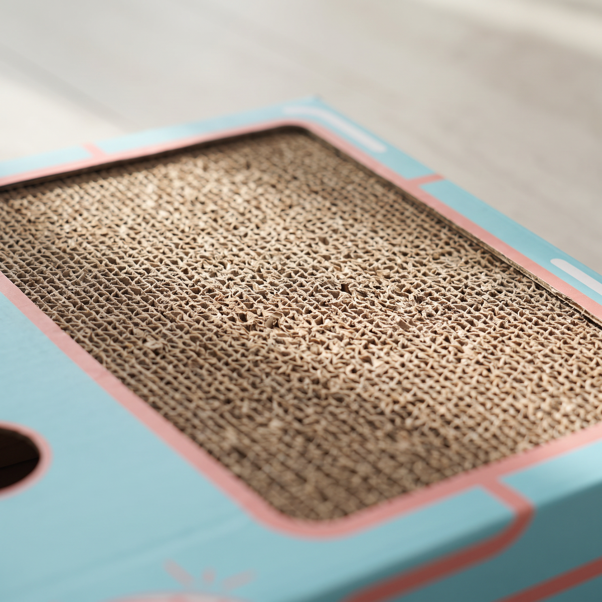 Close up of the corrugated scratch pad on the Ambush cat box toy